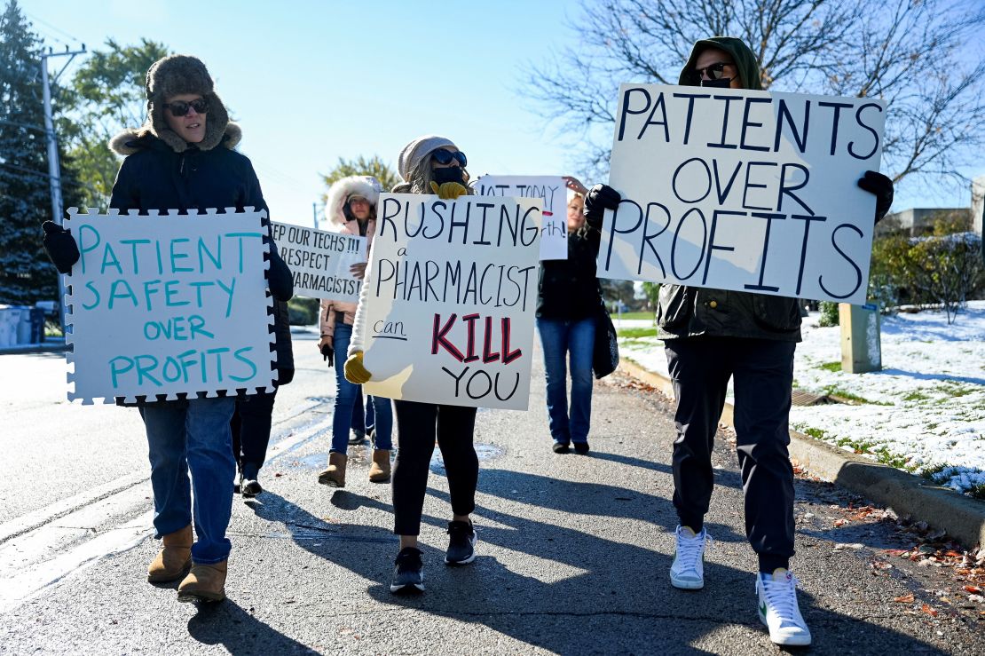 A small number of employees and supporters picket outside the headquarters of drugstore chain Walgreens during a three-day walkout by pharmacists in Deerfield, Illinois, U.S. November 1, 2023. REUTERS/Vincent Alban